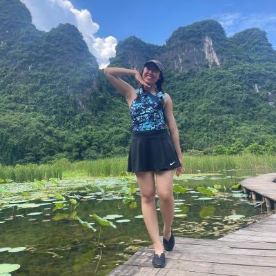Hannah Nguyen posing in front of mountains in Vietnam