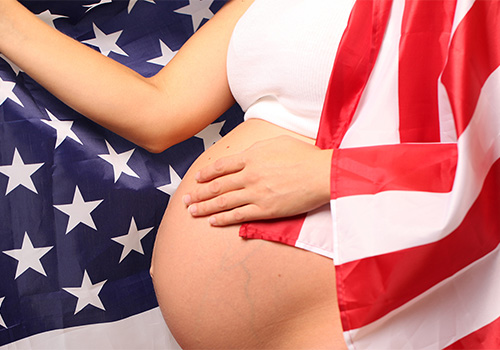 Pregnant lady draped in flag