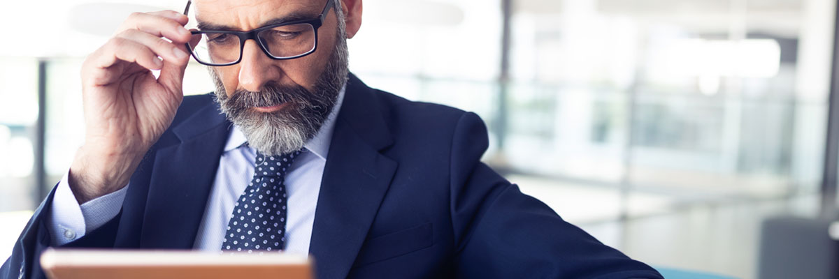 man reading on his iPad